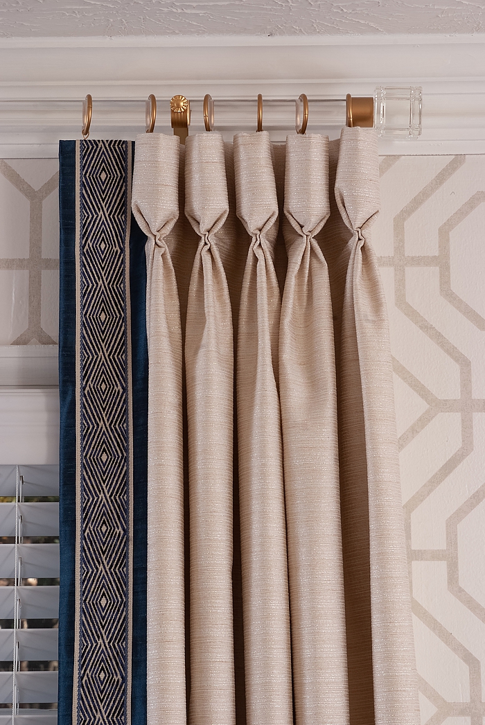 Beautiful goblet pleats combine with a decorative tape in these stunning draperies.