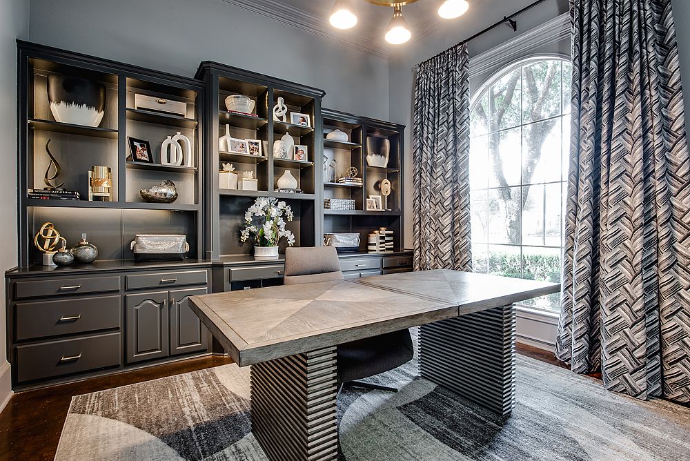 Luxury home office with custom built-in shelving and elegant lighting.